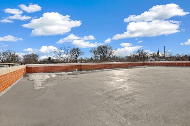 225 Main Street, Unit 214 Roselle, IL 60172 - Photo 25 of 27 a view of a lake and sunset