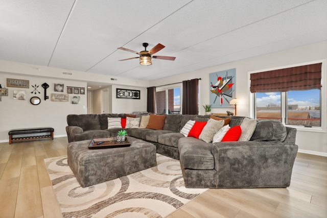 225 Main Street, Unit 214 Roselle, IL 60172 - Photo 5 of 27 a living room with furniture and kitchen view