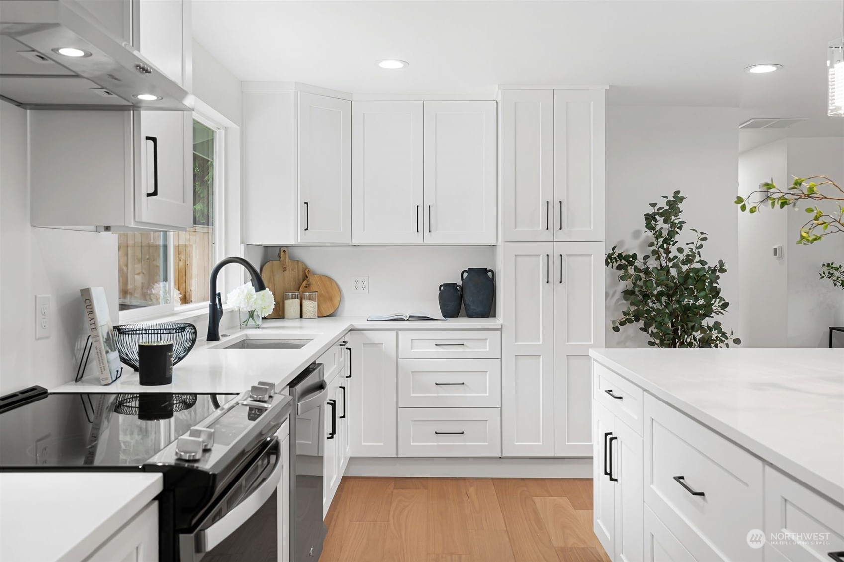 311 217th Place Southwest Bothell, WA 98021 - Photo 15 of 28 a kitchen with white cabinets and appliances