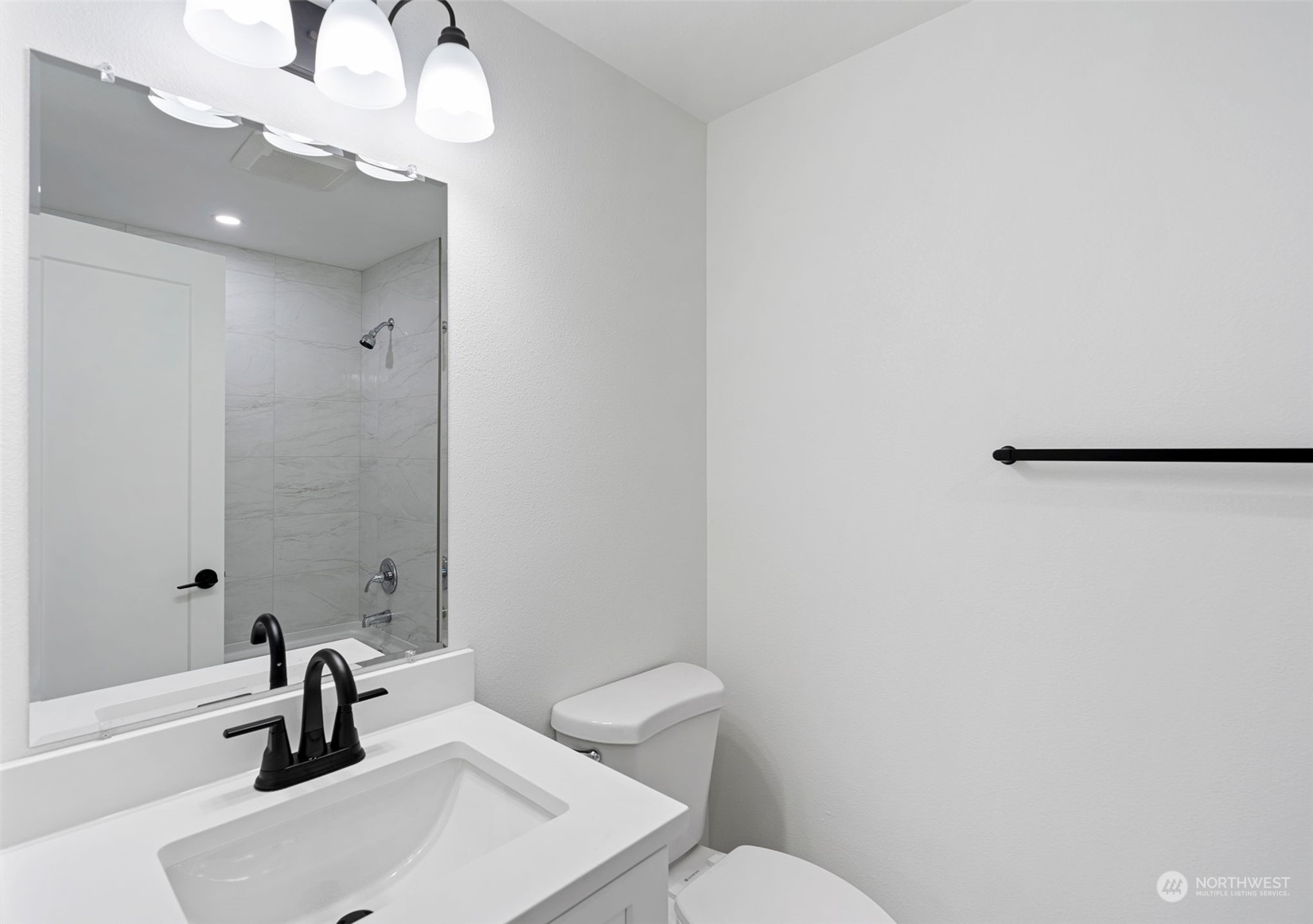 311 217th Place Southwest Bothell, WA 98021 - Photo 18 of 28 a bathroom with a sink a toilet and shower