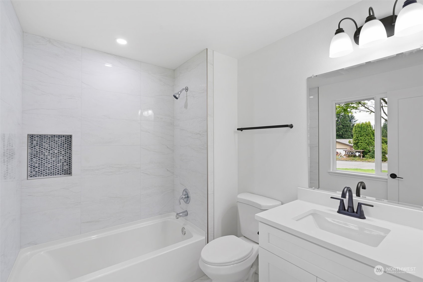 311 217th Place Southwest Bothell, WA 98021 - Photo 23 of 28 a bathroom with a sink toilet a mirror and shower