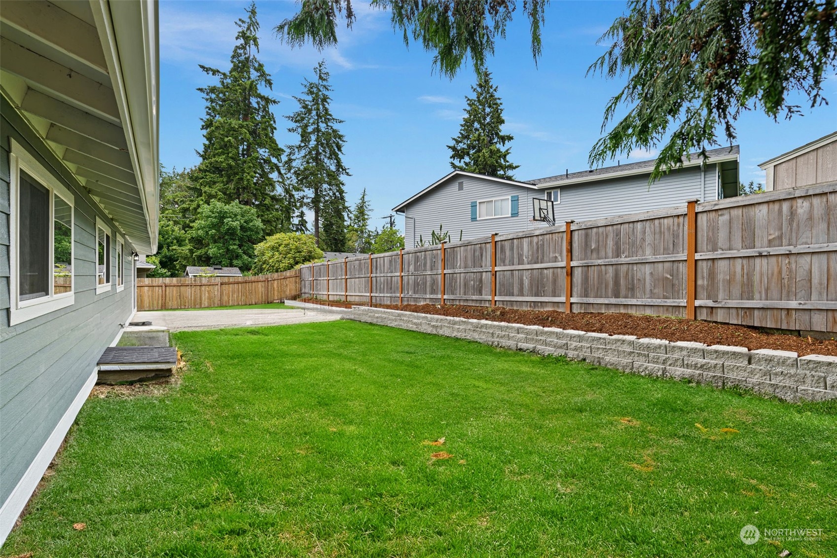 311 217th Place Southwest Bothell, WA 98021 - Photo 27 of 28 a view of a backyard with a small garden