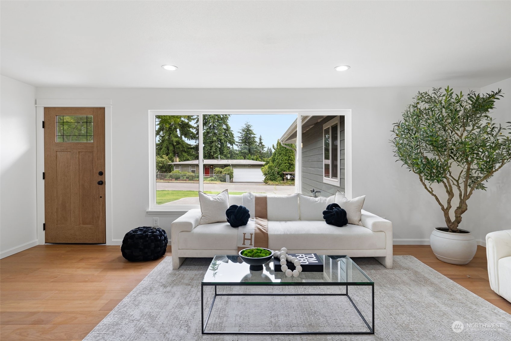 311 217th Place Southwest Bothell, WA 98021 - Photo 3 of 28 a living room with furniture and a potted plant