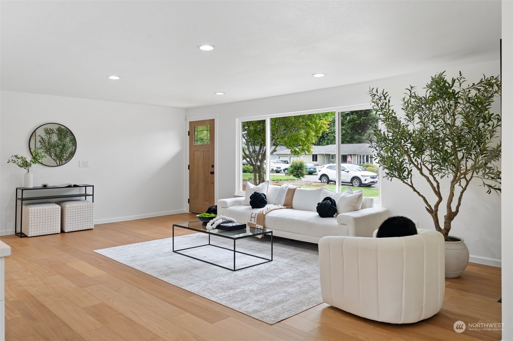 311 217th Place Southwest Bothell, WA 98021 - Photo 4 of 28 a living room with furniture potted plant and a large window
