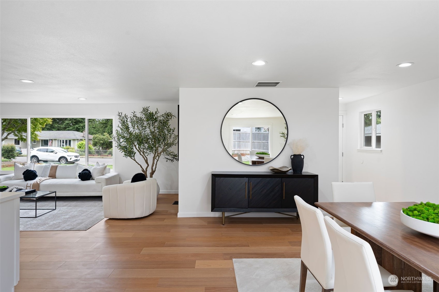 311 217th Place Southwest Bothell, WA 98021 - Photo 10 of 28 a living room with furniture a large window and a potted plant