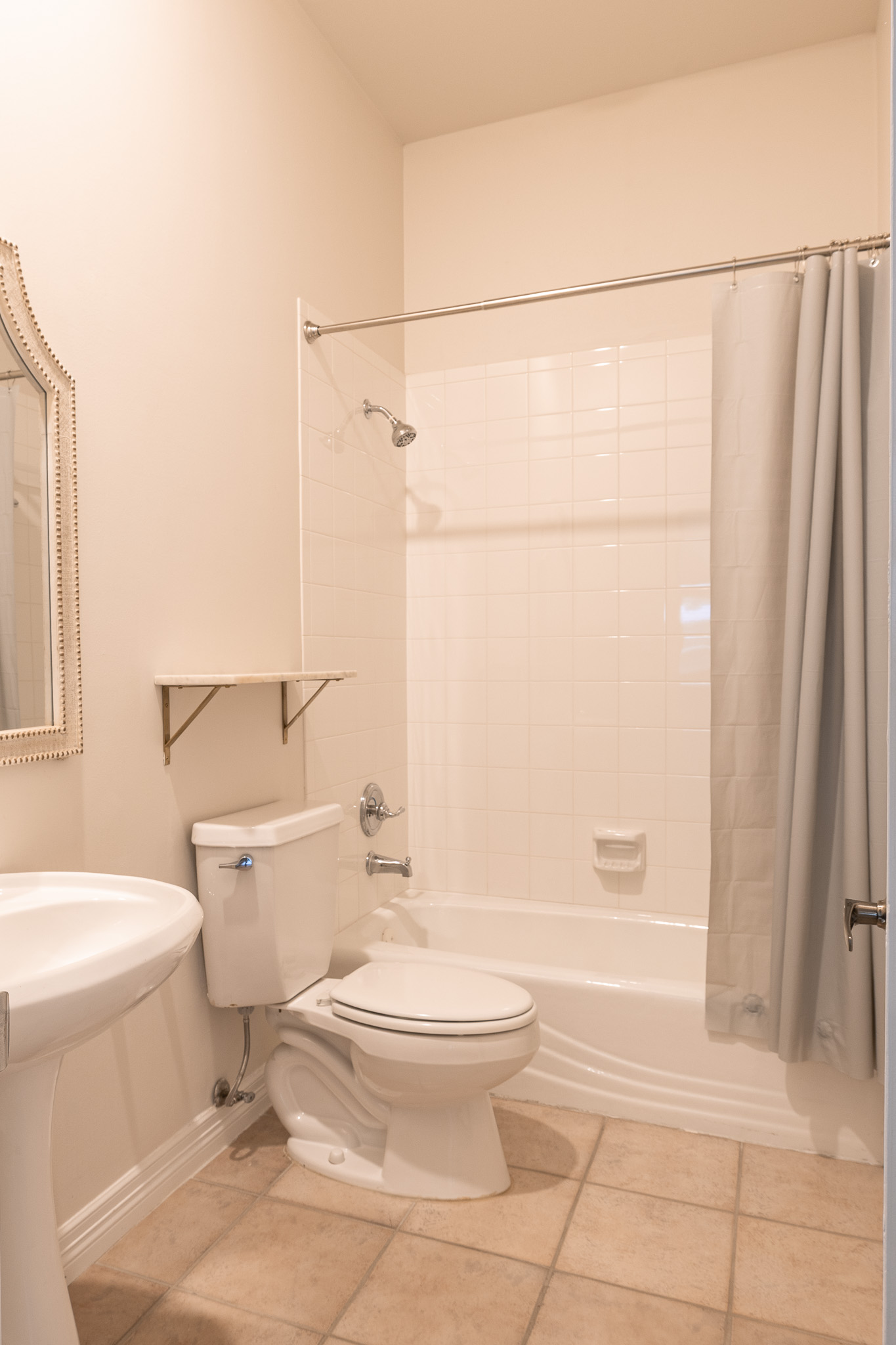 2906 Mill Reef Cove Austin, TX 78746 - Photo 29 of 38 a white toilet sitting next to a bathroom sink