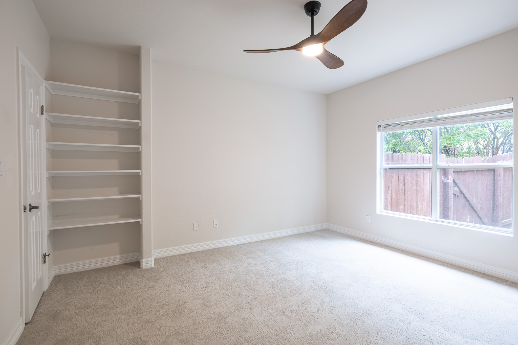 2906 Mill Reef Cove Austin, TX 78746 - Photo 31 of 38 a view of an empty room with a window