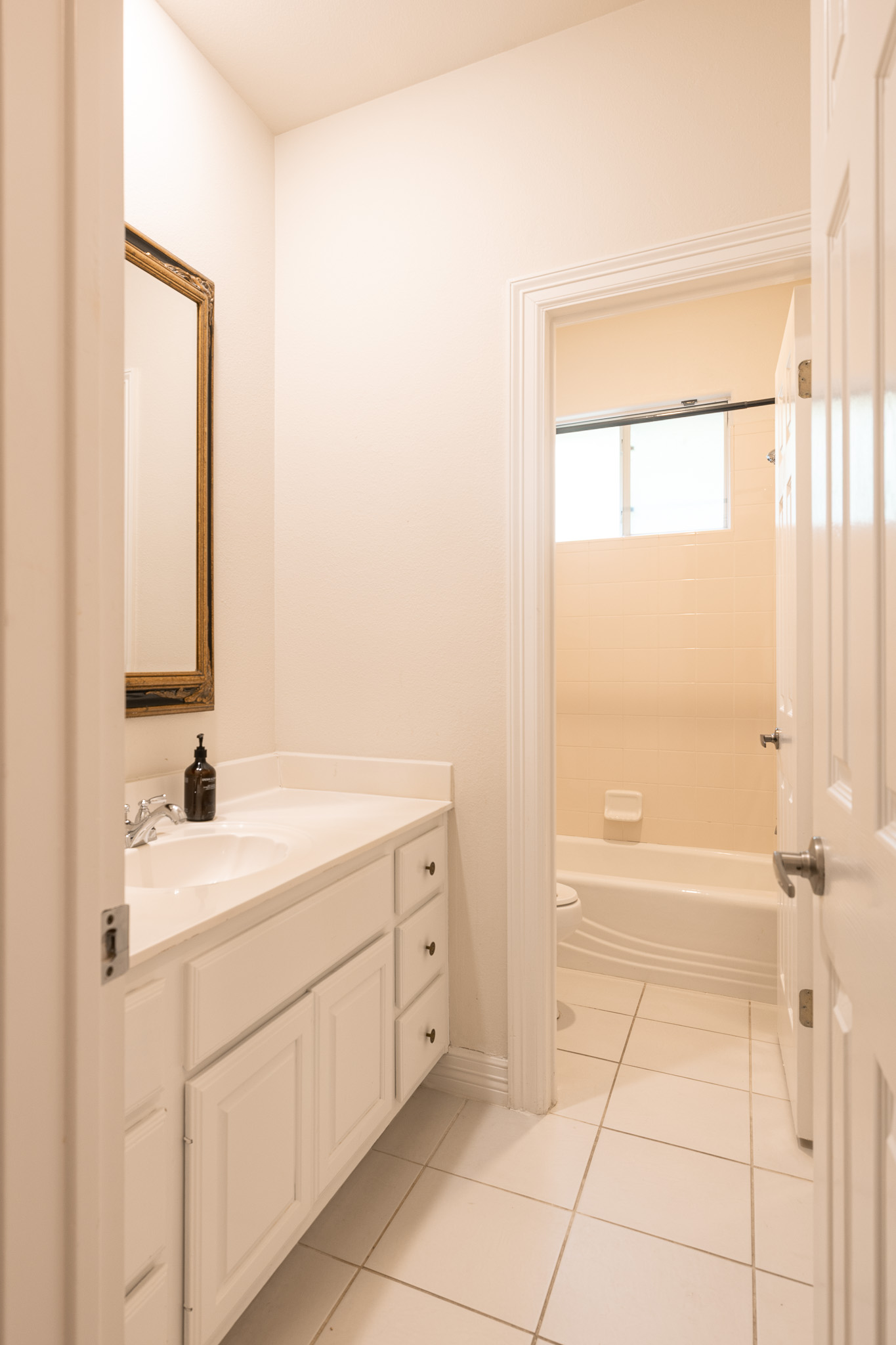 2906 Mill Reef Cove Austin, TX 78746 - Photo 32 of 38 a bathroom with a sink a toilet and tub