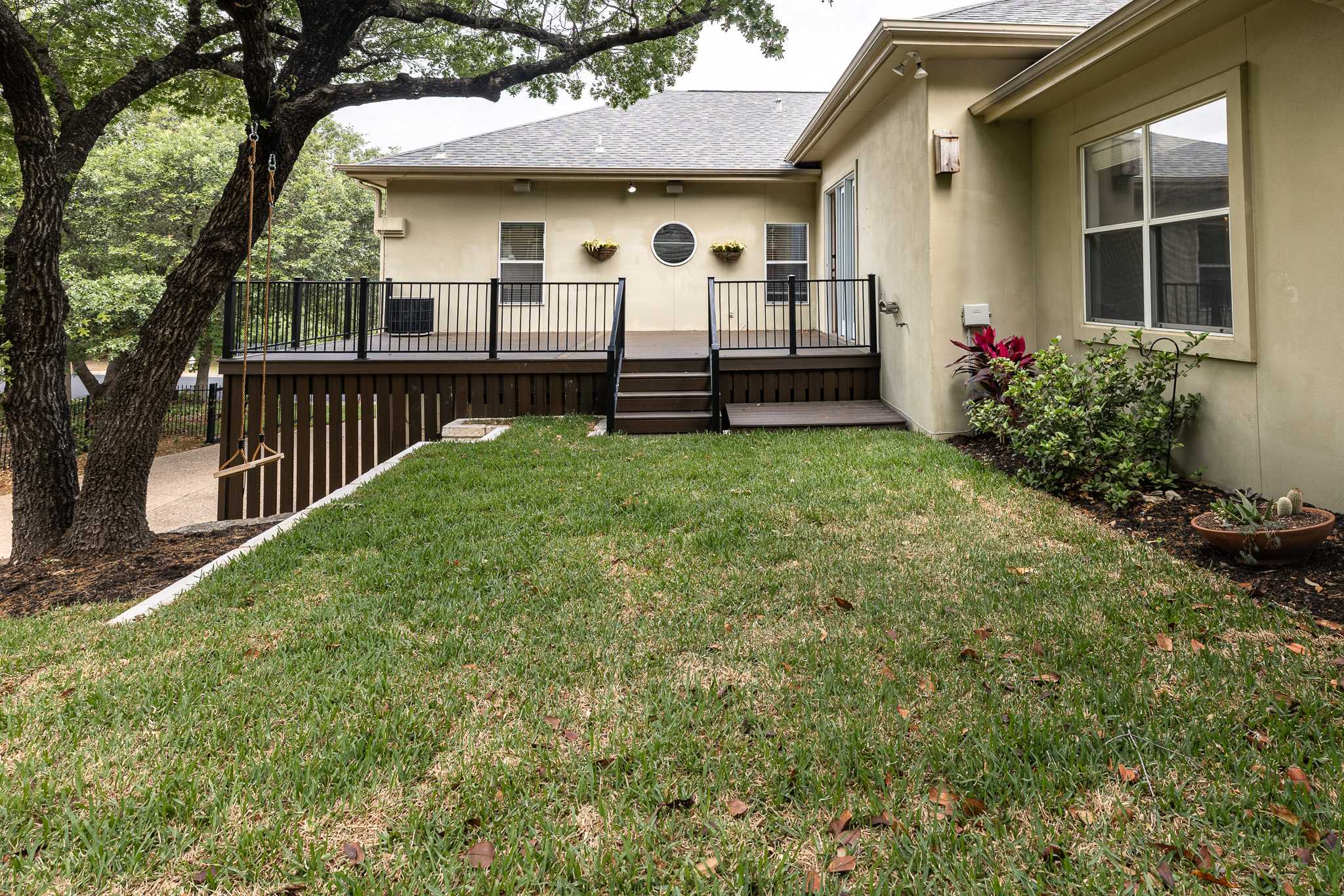 2906 Mill Reef Cove Austin, TX 78746 - Photo 38 of 38 a front view of a house with a yard