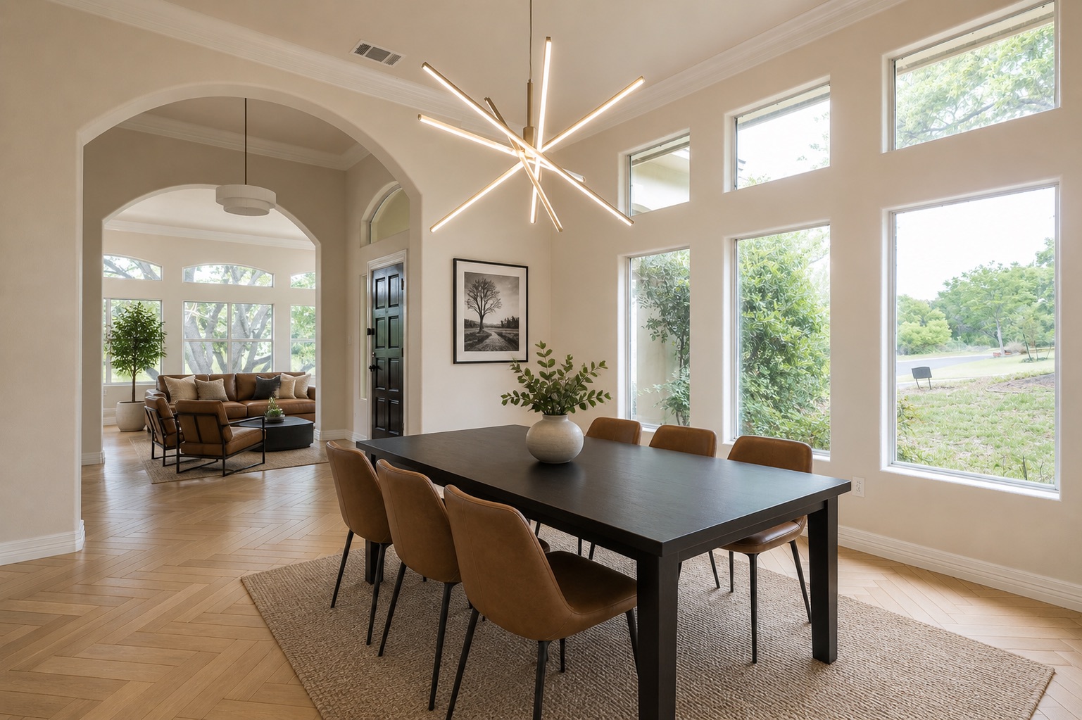 2906 Mill Reef Cove Austin, TX 78746 - Photo 4 of 38 a view of a dining room and livingroom with furniture wooden floor a chandelier