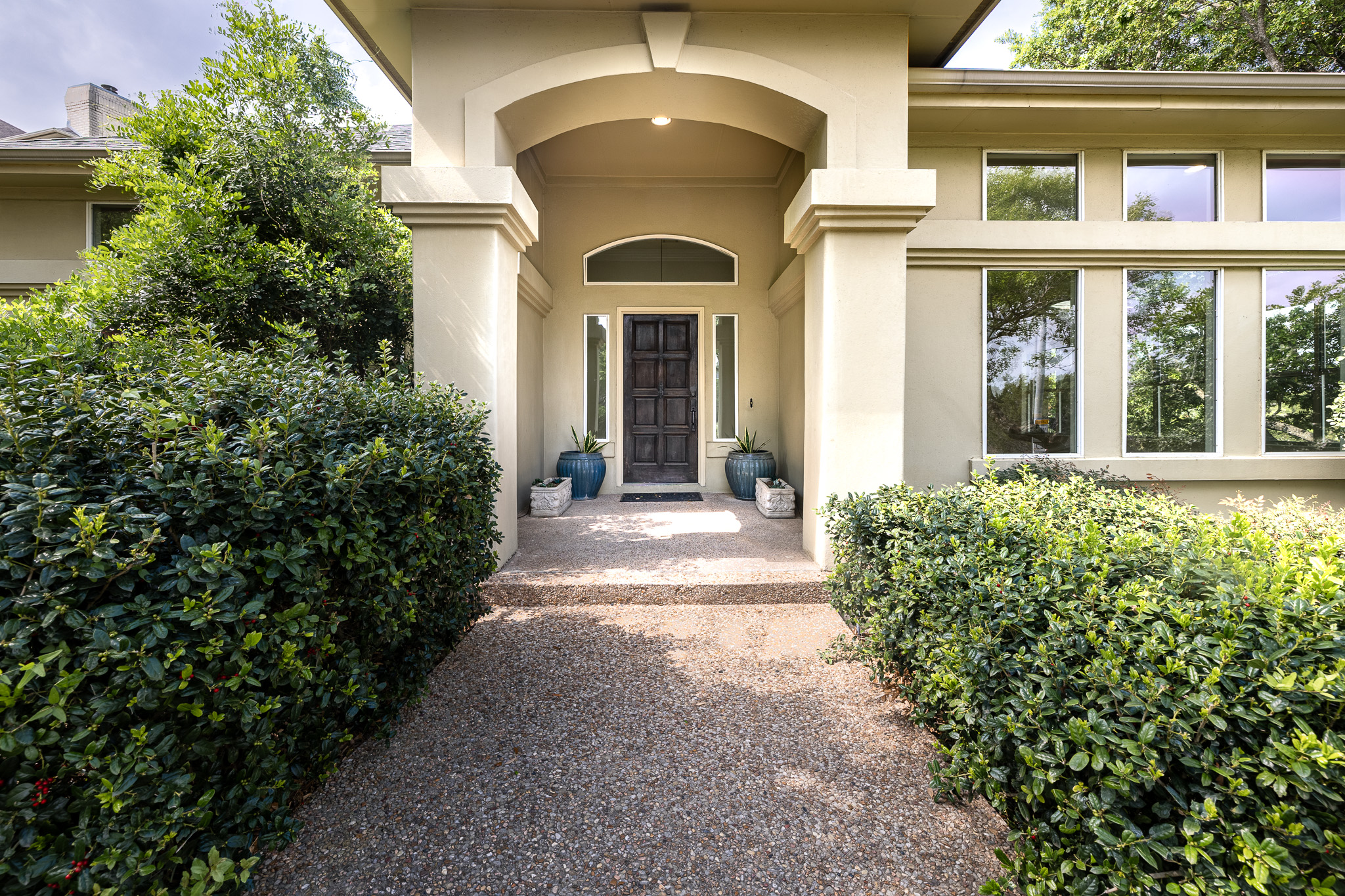2906 Mill Reef Cove Austin, TX 78746 - Photo 7 of 38 a view of a house with potted plants