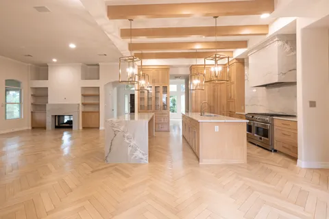 a stove top oven sitting inside of a kitchen