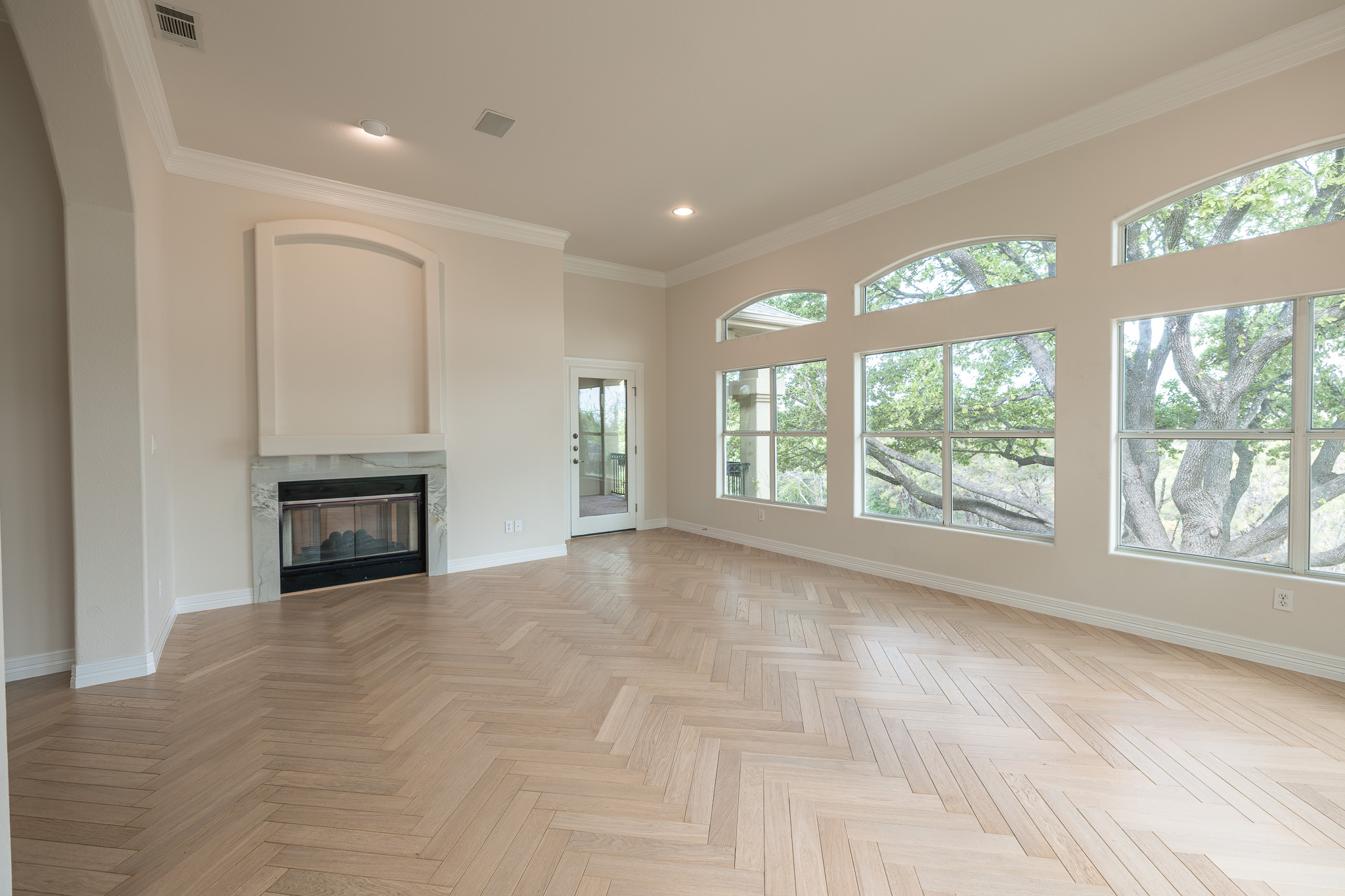 2906 Mill Reef Cove Austin, TX 78746 - Photo 10 of 38 a view of empty room with large windows