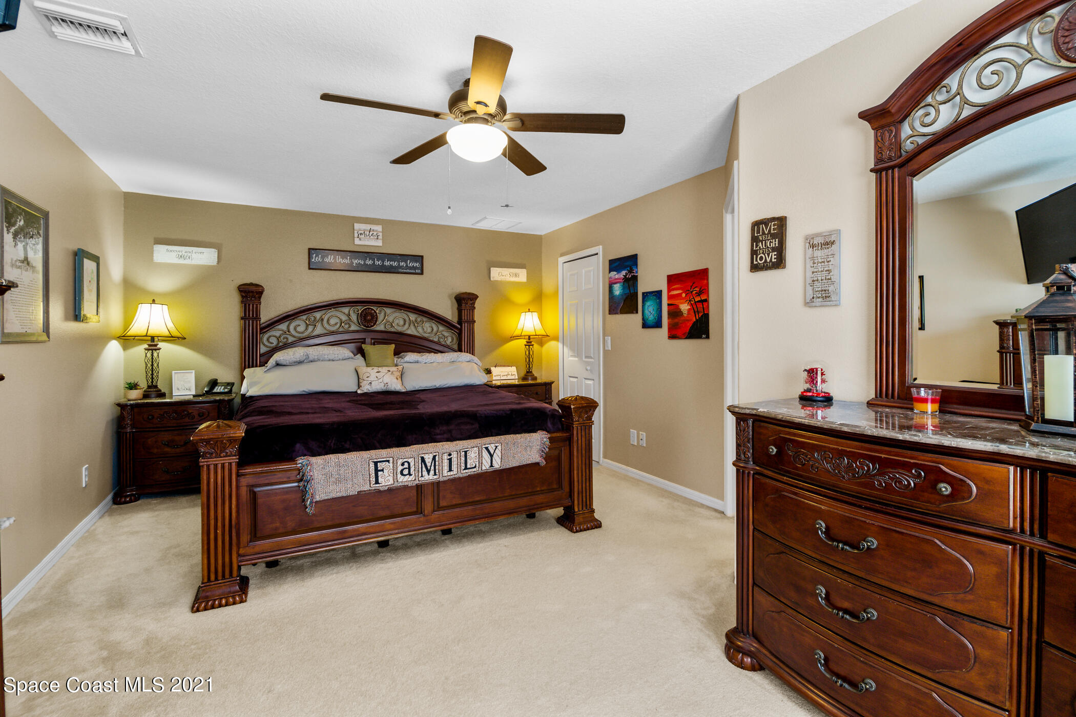 6336 Hudson Road Cocoa, FL 32927 - Photo 13 of 24 a bedroom with a bed and a chandelier