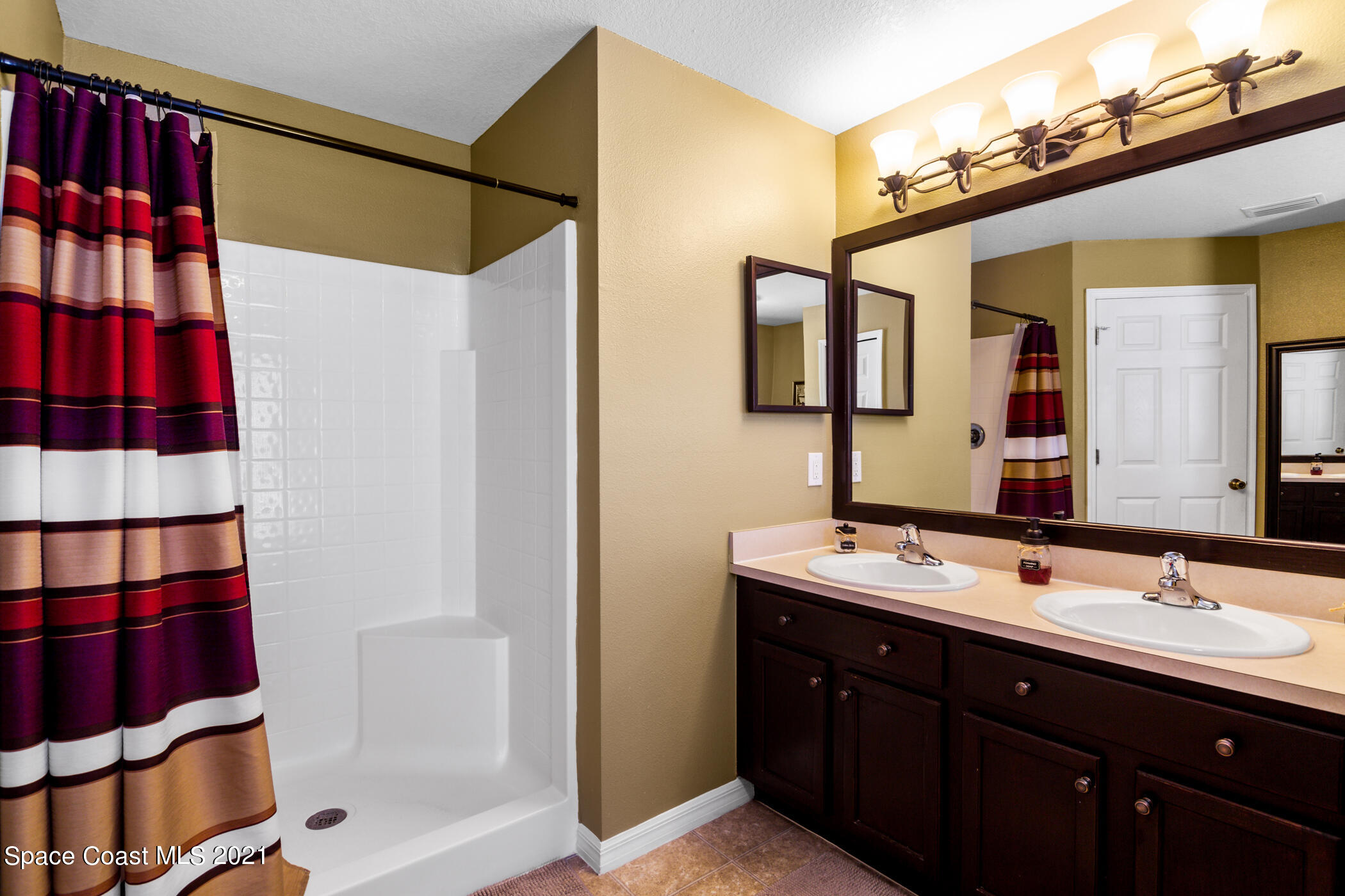 6336 Hudson Road Cocoa, FL 32927 - Photo 14 of 24 a bathroom with a sink and a mirror