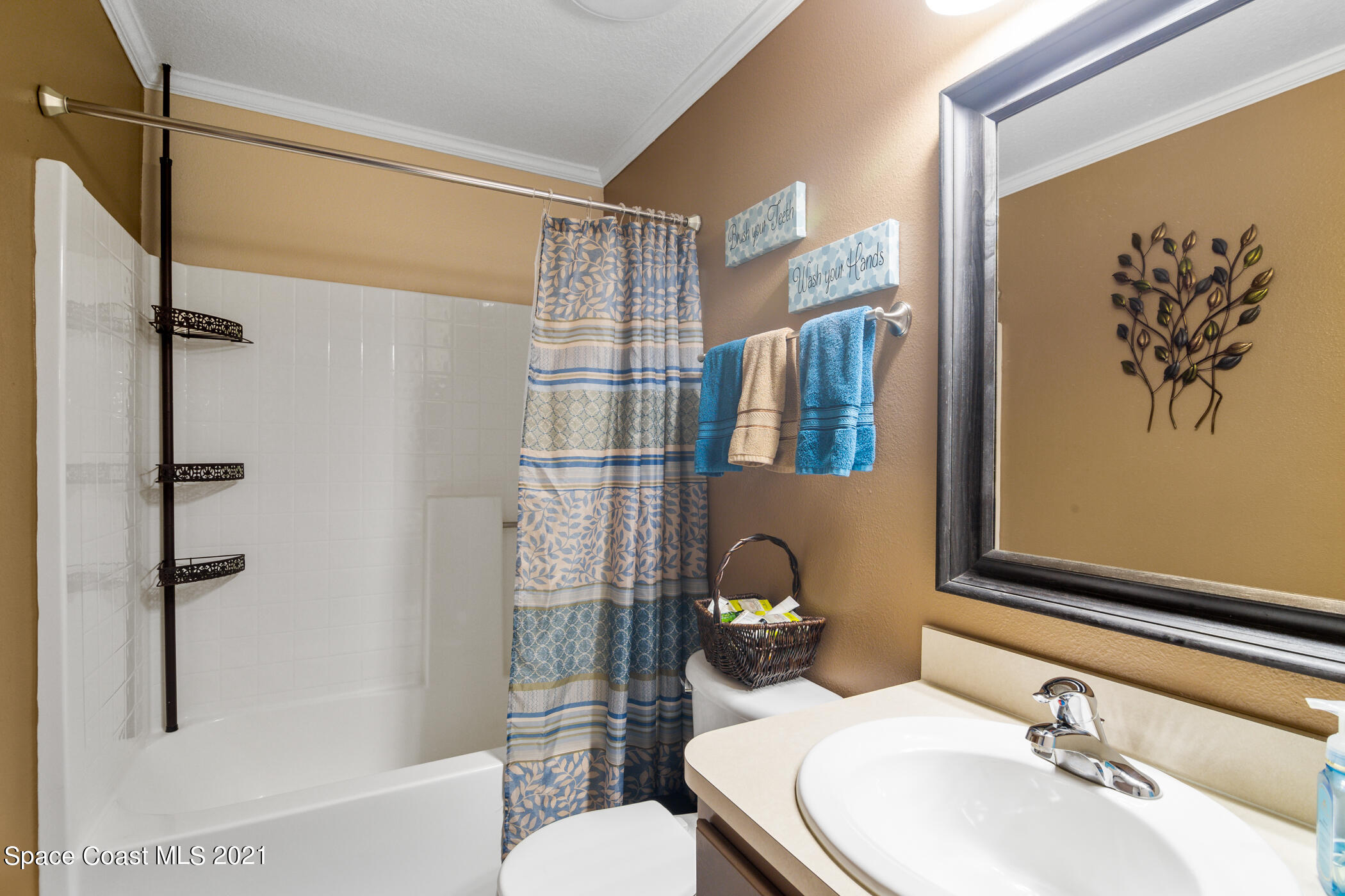 6336 Hudson Road Cocoa, FL 32927 - Photo 17 of 24 a bathroom with a sink toilet and shower