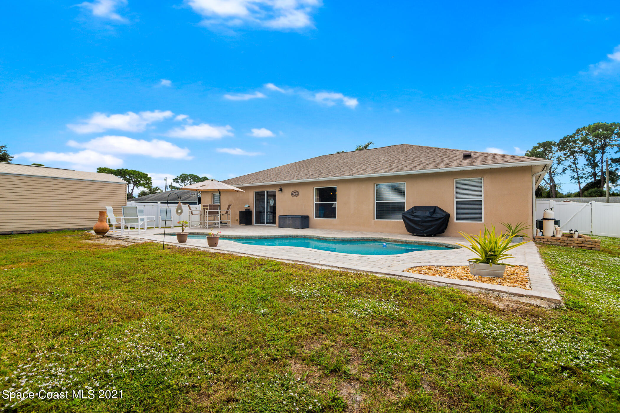 6336 Hudson Road Cocoa, FL 32927 - Photo 19 of 24 a front view of house with yard and seating area