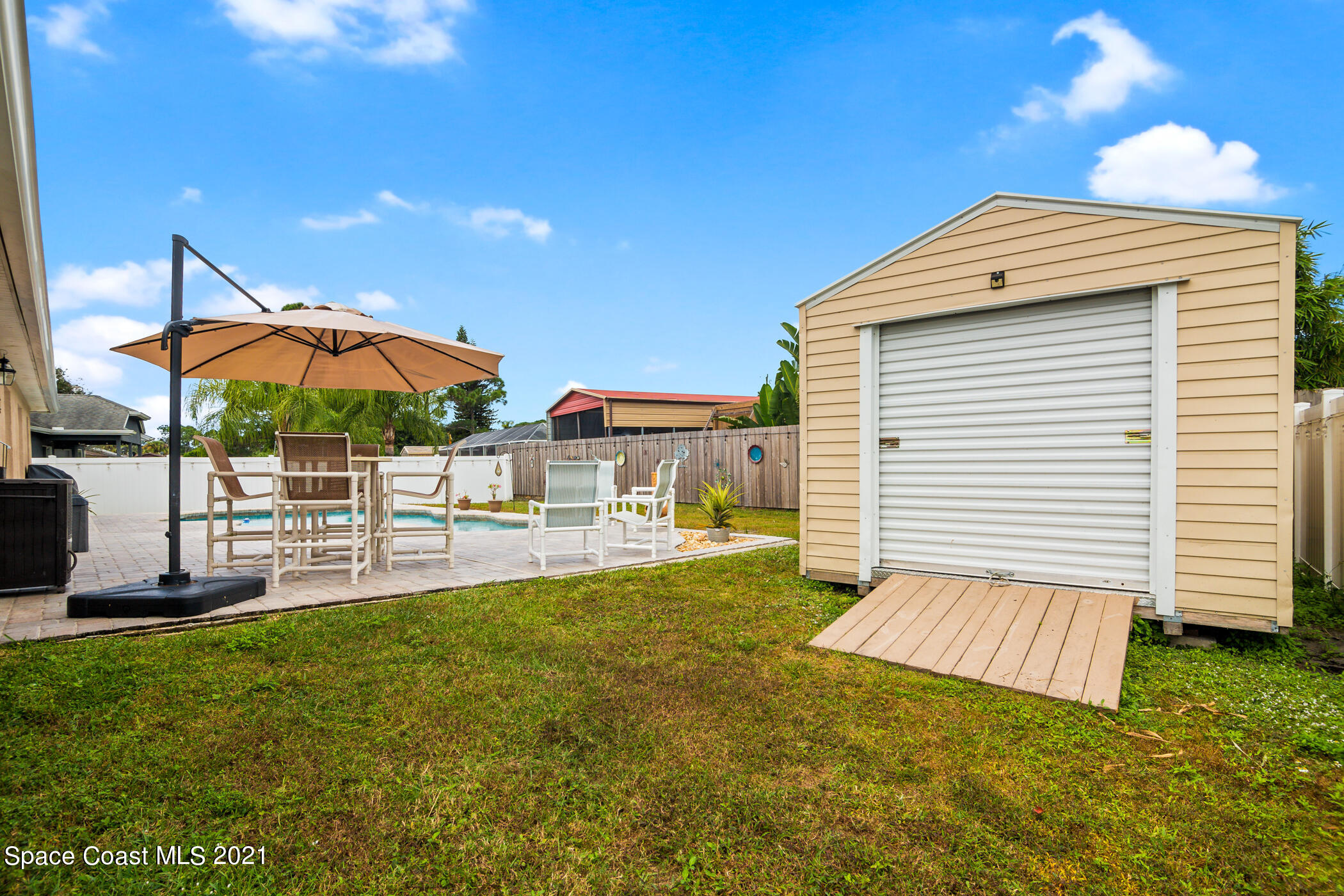 6336 Hudson Road Cocoa, FL 32927 - Photo 23 of 24 a view of a house with backyard and sitting area