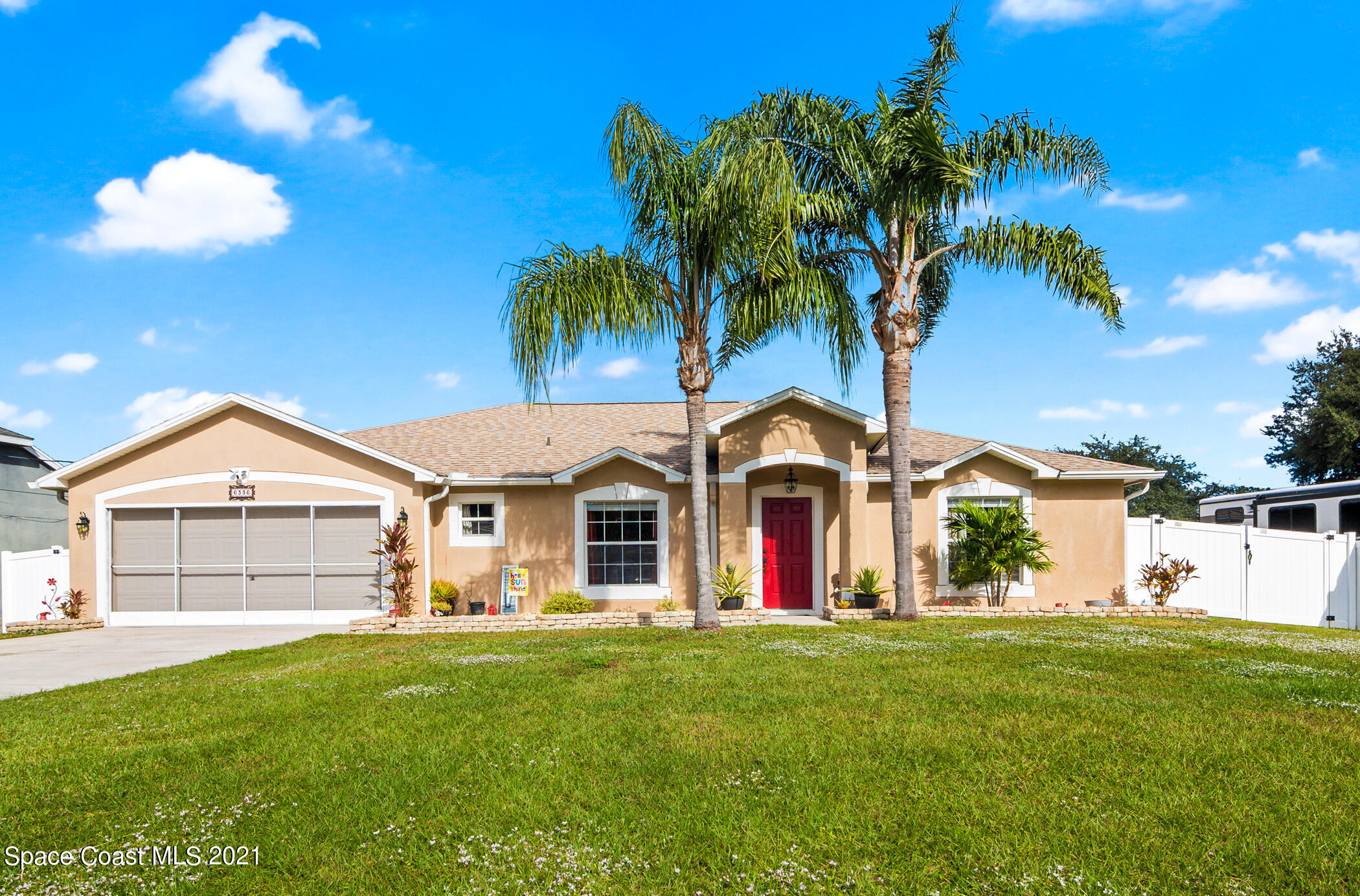 6336 Hudson Road Cocoa, FL 32927 - Photo 24 of 24 a view of a house with a swimming pool and a big yard