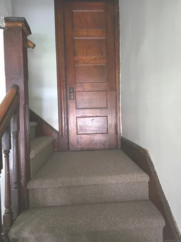 a view of an empty room and fire place