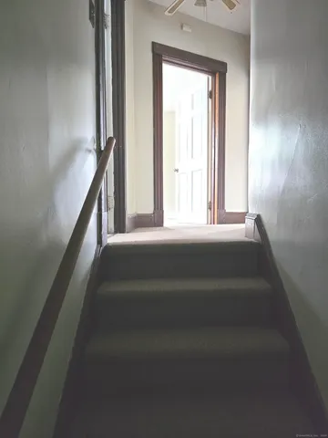 a view of staircase with window