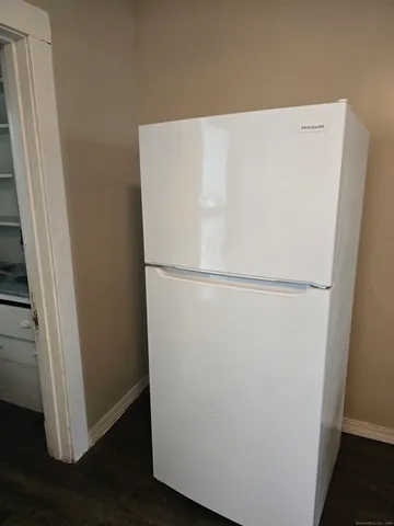 a view of door with wooden floor