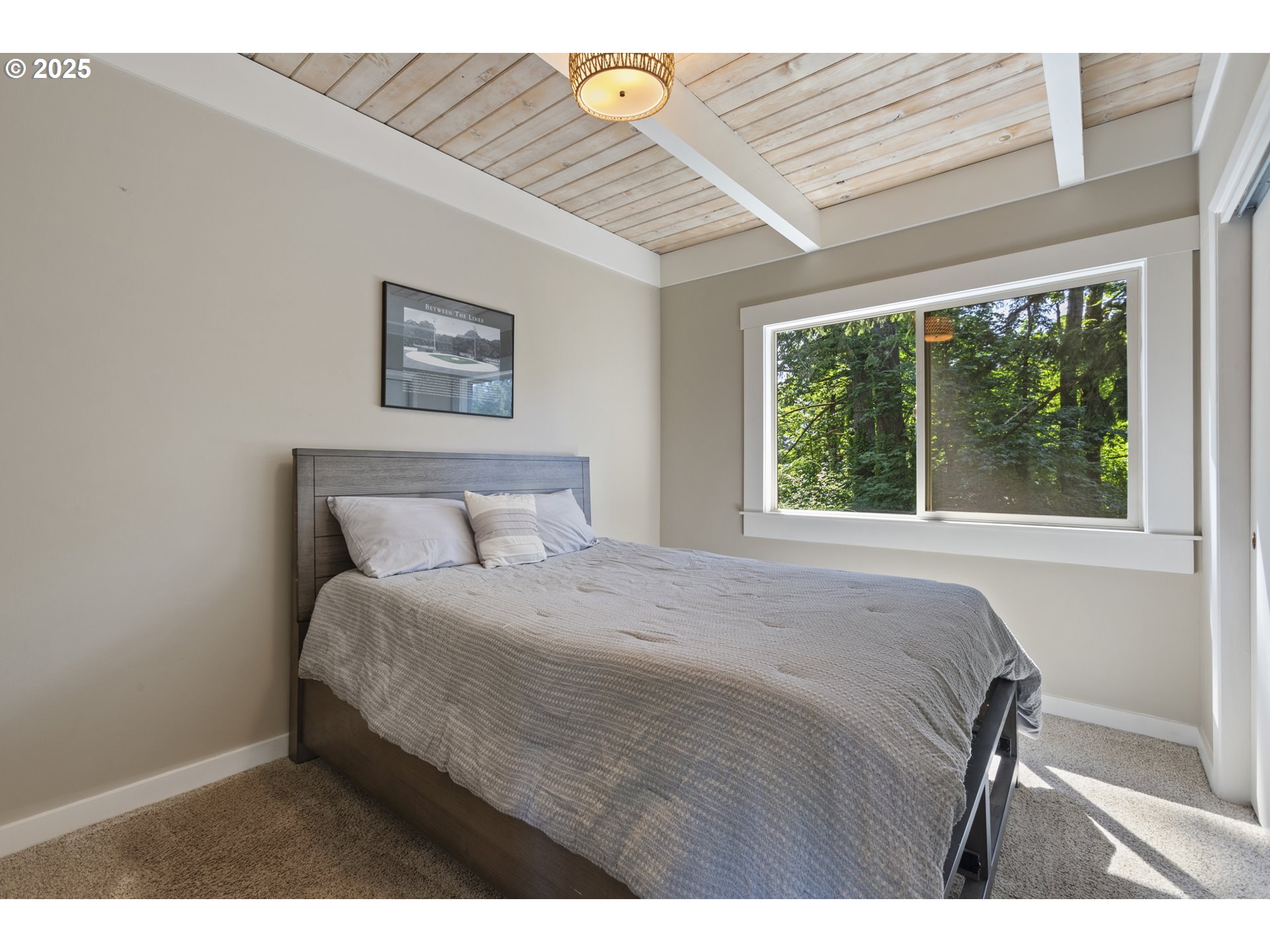 28825 Southwest Grahams Ferry Road Wilsonville, OR 97070 - Photo 15 of 36 a bedroom with a bed and a window