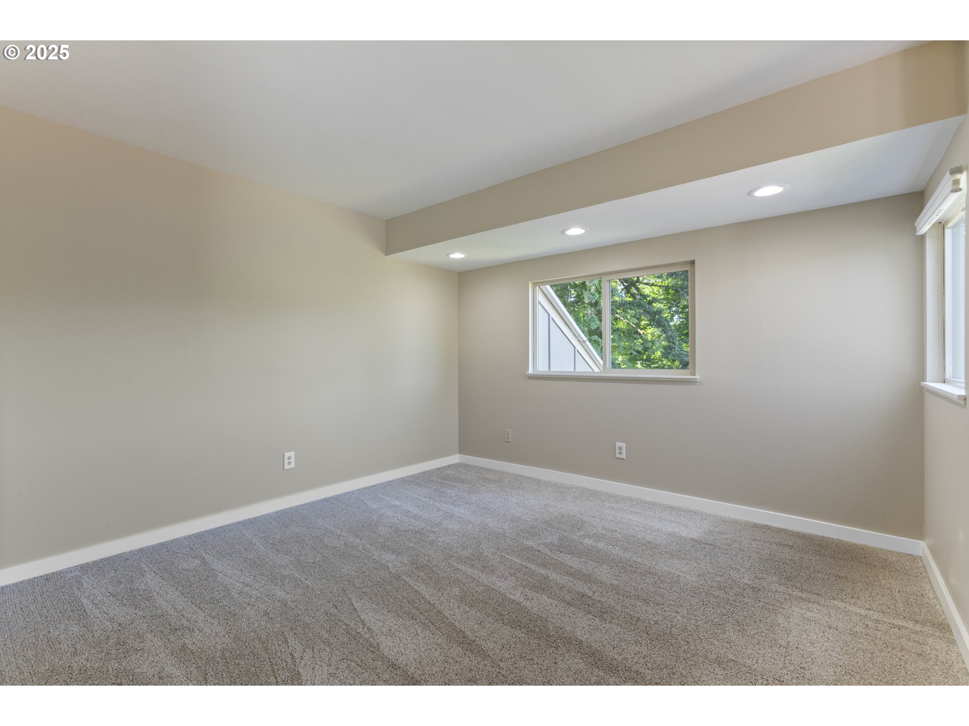 28825 Southwest Grahams Ferry Road Wilsonville, OR 97070 - Photo 17 of 36 a view of an empty room with wooden floor and a window