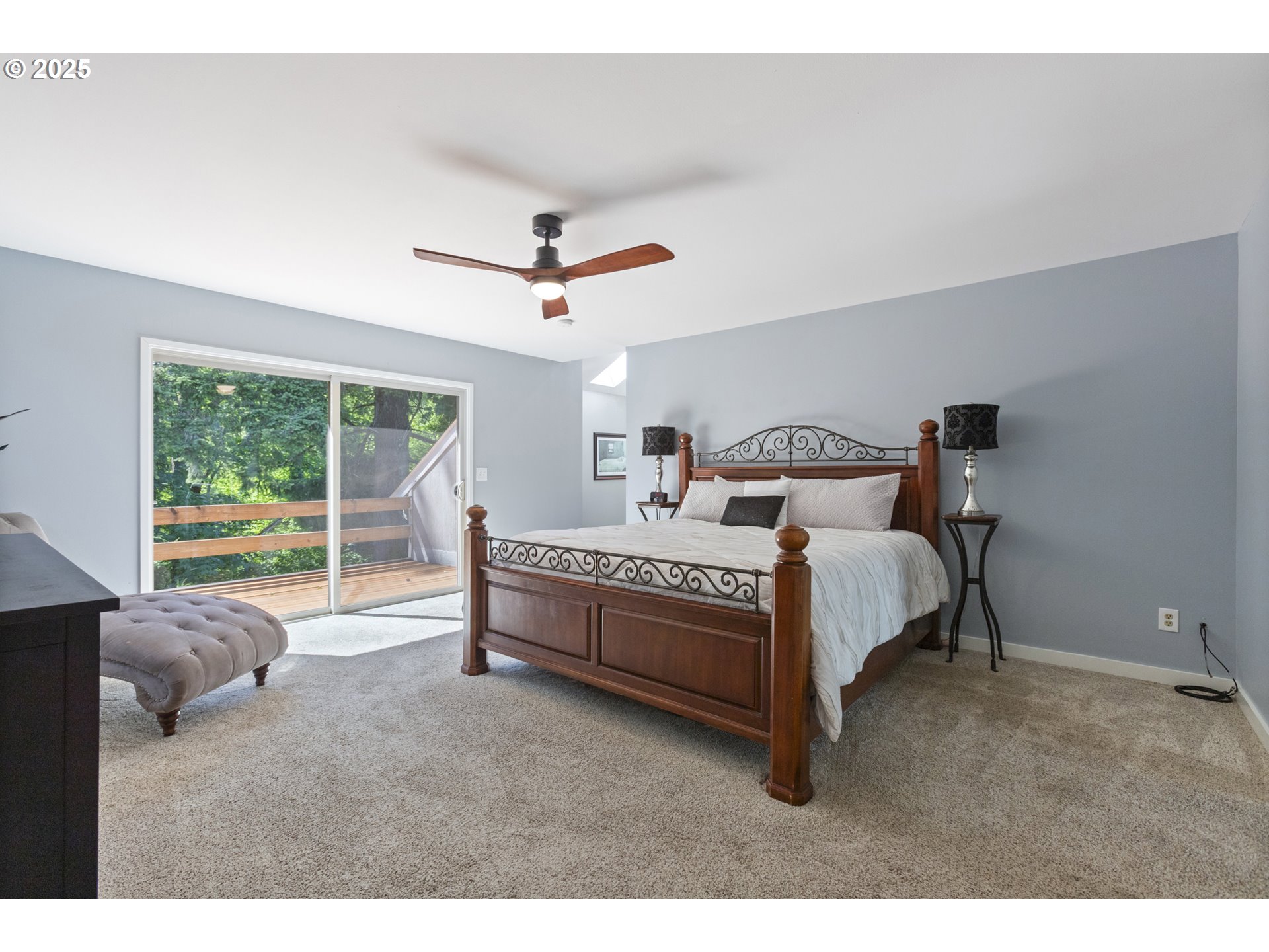 28825 Southwest Grahams Ferry Road Wilsonville, OR 97070 - Photo 19 of 36 a bed room with a bed and a large window