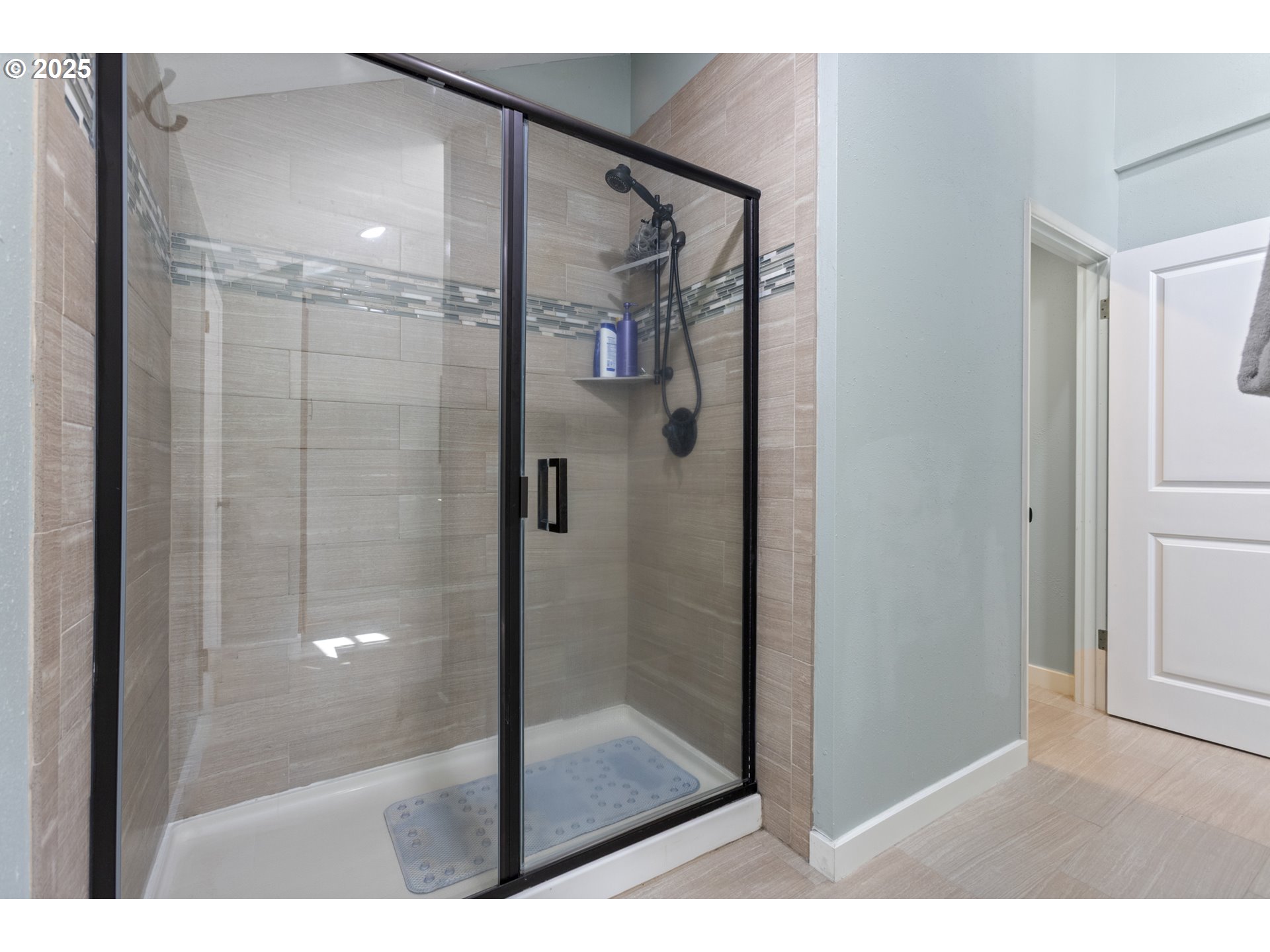 28825 Southwest Grahams Ferry Road Wilsonville, OR 97070 - Photo 24 of 36 a bathroom with a glass shower door