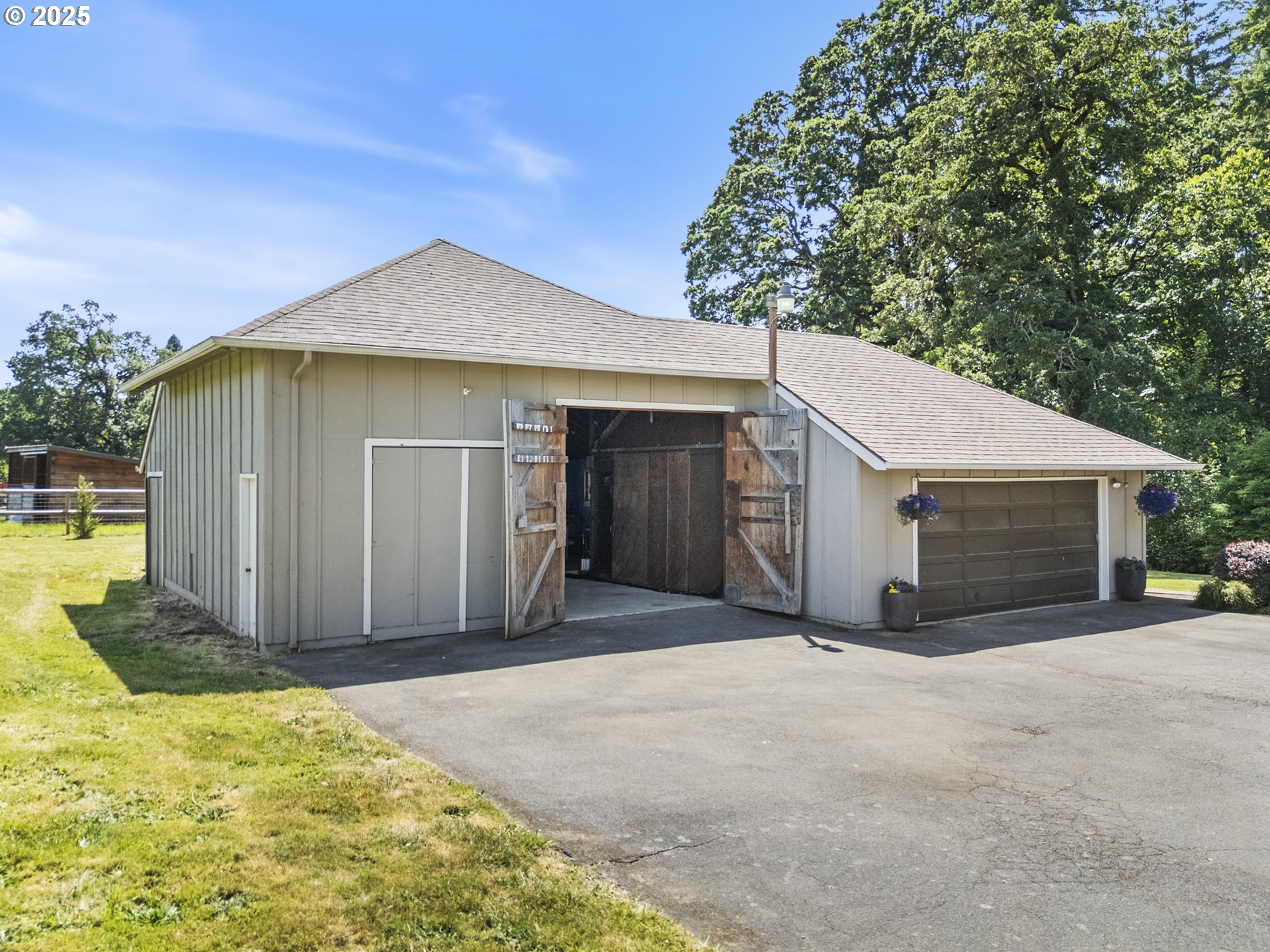 28825 Southwest Grahams Ferry Road Wilsonville, OR 97070 - Photo 28 of 36 a front view of a house with a garage