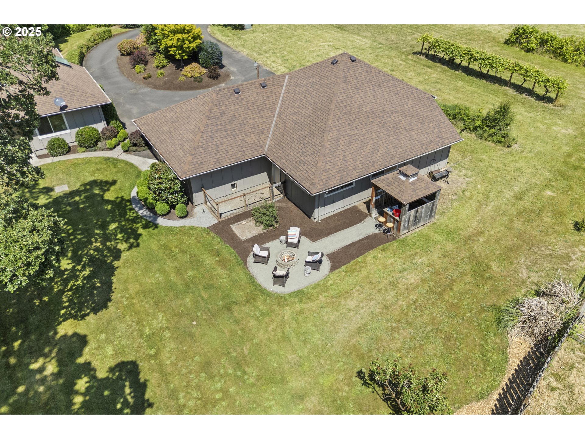 28825 Southwest Grahams Ferry Road Wilsonville, OR 97070 - Photo 33 of 36 an aerial view of a house with garden space and lake view