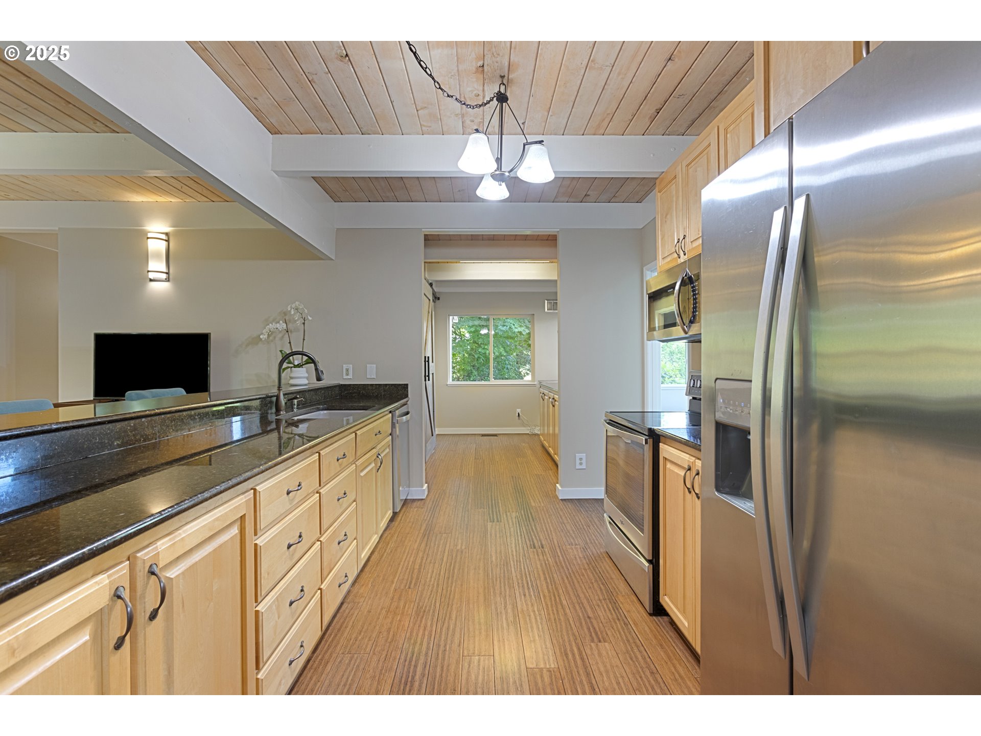 28825 Southwest Grahams Ferry Road Wilsonville, OR 97070 - Photo 10 of 36 a kitchen with stainless steel appliances a refrigerator and a sink