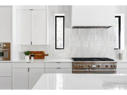 a kitchen with a stove and a cabinets