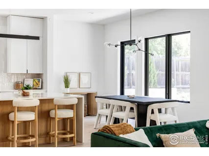 a living room with furniture a window and appliances