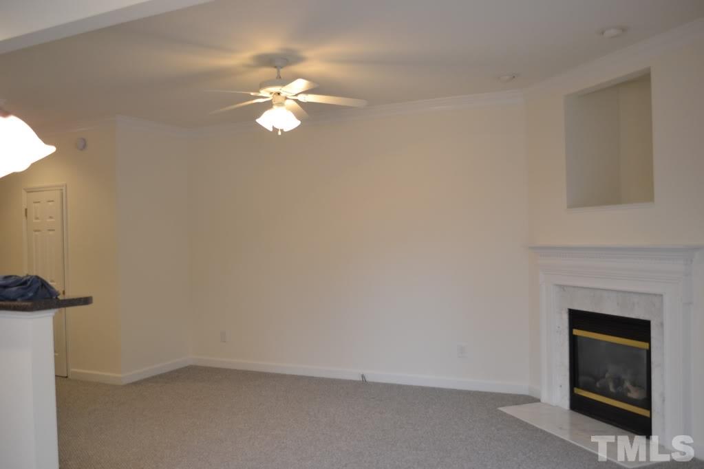 5429 Goldenglow Way Raleigh, NC 27606 - Photo 3 of 21 a view of empty room with fireplace