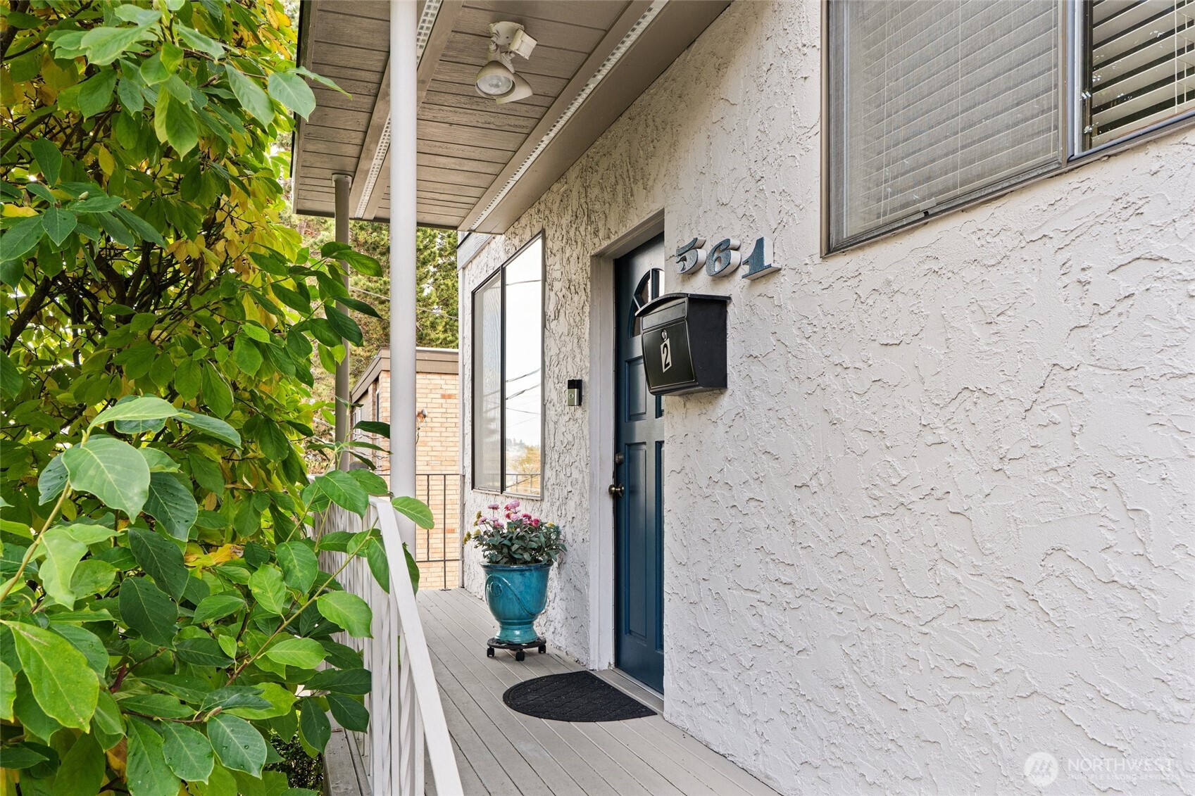 561 Lee Street Seattle, WA 98109 - Photo 27 of 40 a bathroom with a sink and a mirror