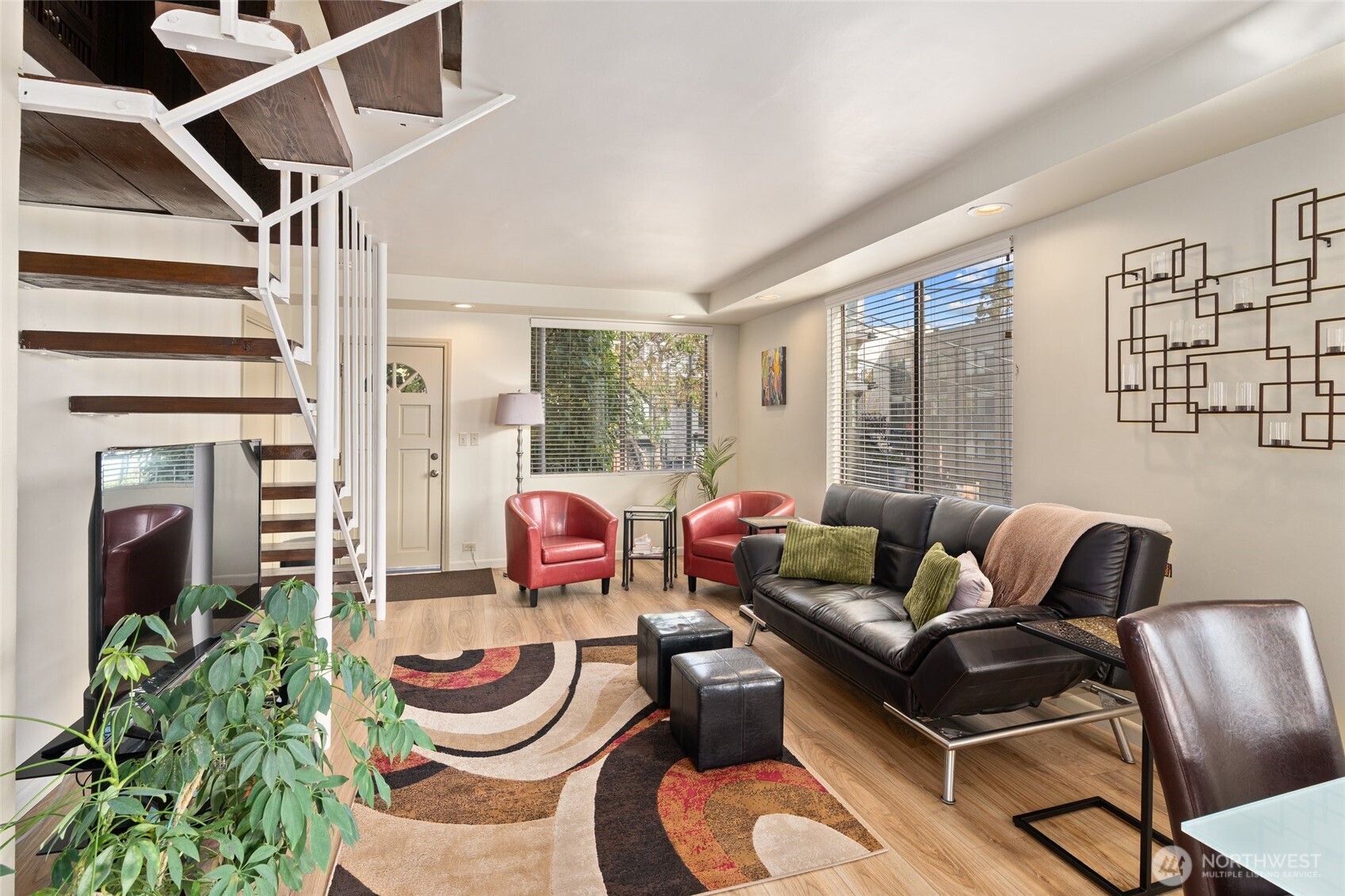 561 Lee Street Seattle, WA 98109 - Photo 6 of 40 a living room with furniture and a floor to ceiling window