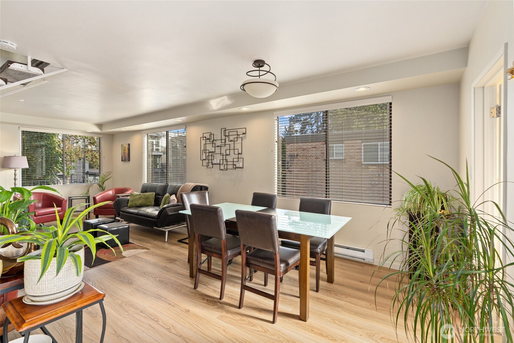 561 Lee Street Seattle, WA 98109 - Photo 9 of 40 a view of a dining room with furniture window and wooden floor