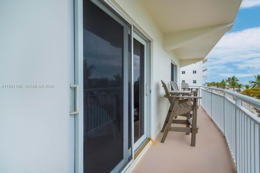 901 South Surf Road, Unit 408 Hollywood, FL 33019 - Photo 13 of 52 a view of a hallway with wooden floor and stairs