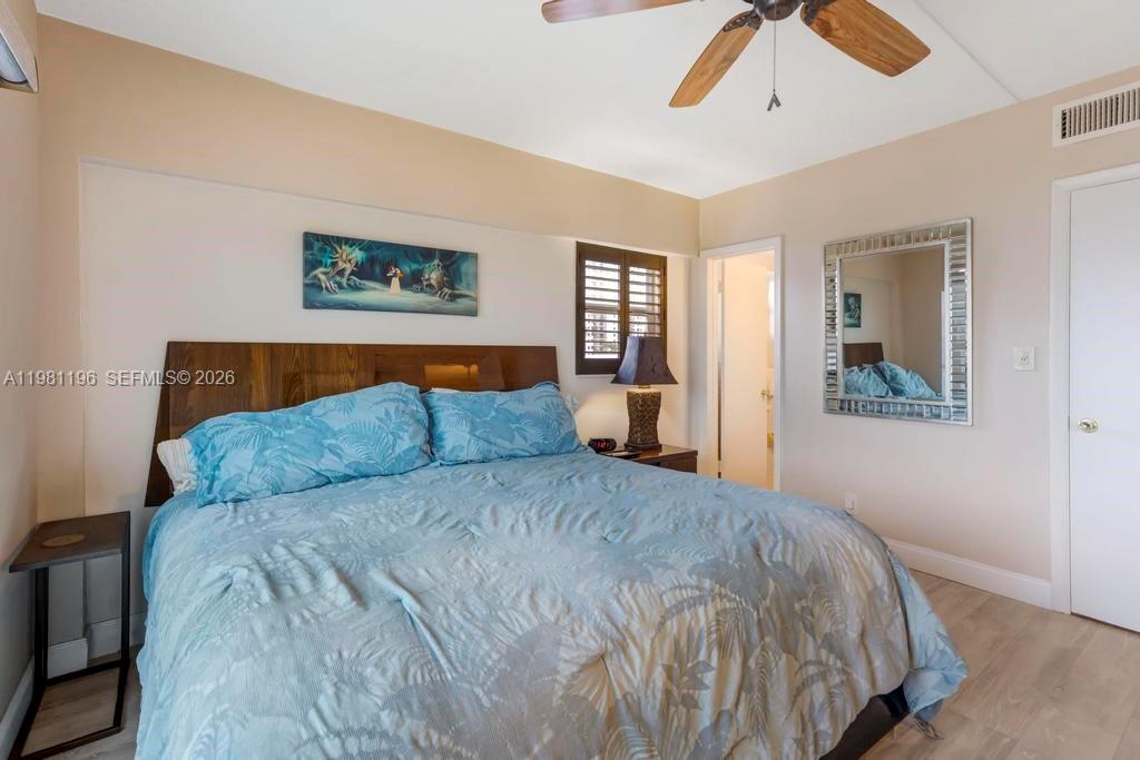 901 South Surf Road, Unit 408 Hollywood, FL 33019 - Photo 19 of 52 a bedroom with a large bed and a window
