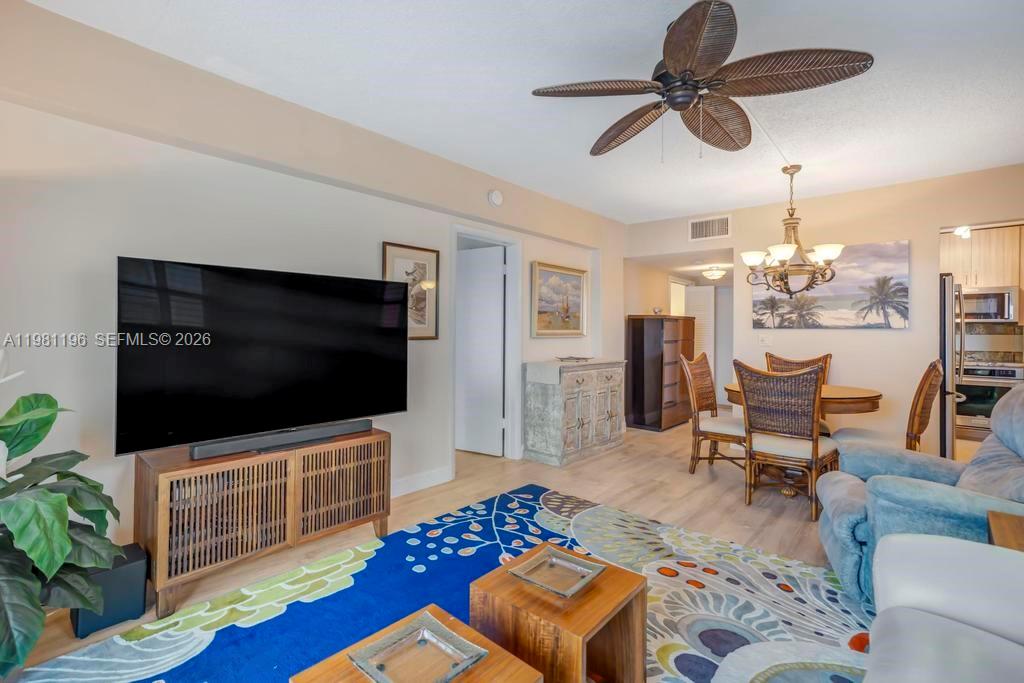 901 South Surf Road, Unit 408 Hollywood, FL 33019 - Photo 21 of 52 a living room with furniture and a flat screen tv