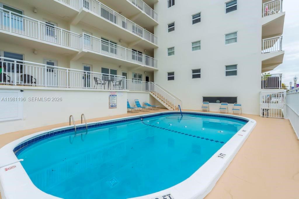 901 South Surf Road, Unit 408 Hollywood, FL 33019 - Photo 29 of 52 a view of a swimming pool with an outdoor seating