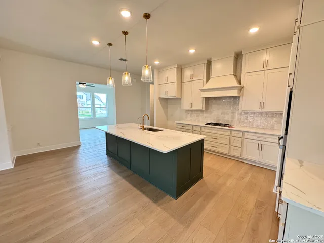 a view of a kitchen and a sink