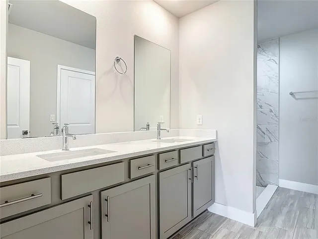 a view of an empty room and wooden floor