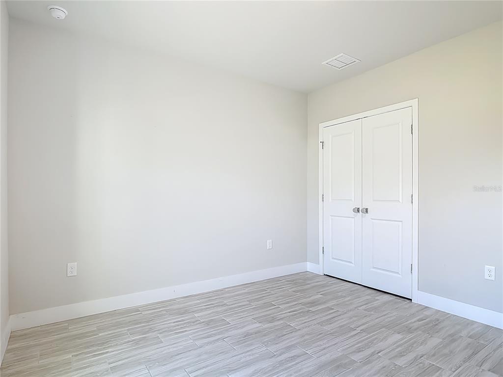 60 Ballenger Lane Palm Coast, FL 32137 - Photo 33 of 60 a view of an empty room and wooden floor