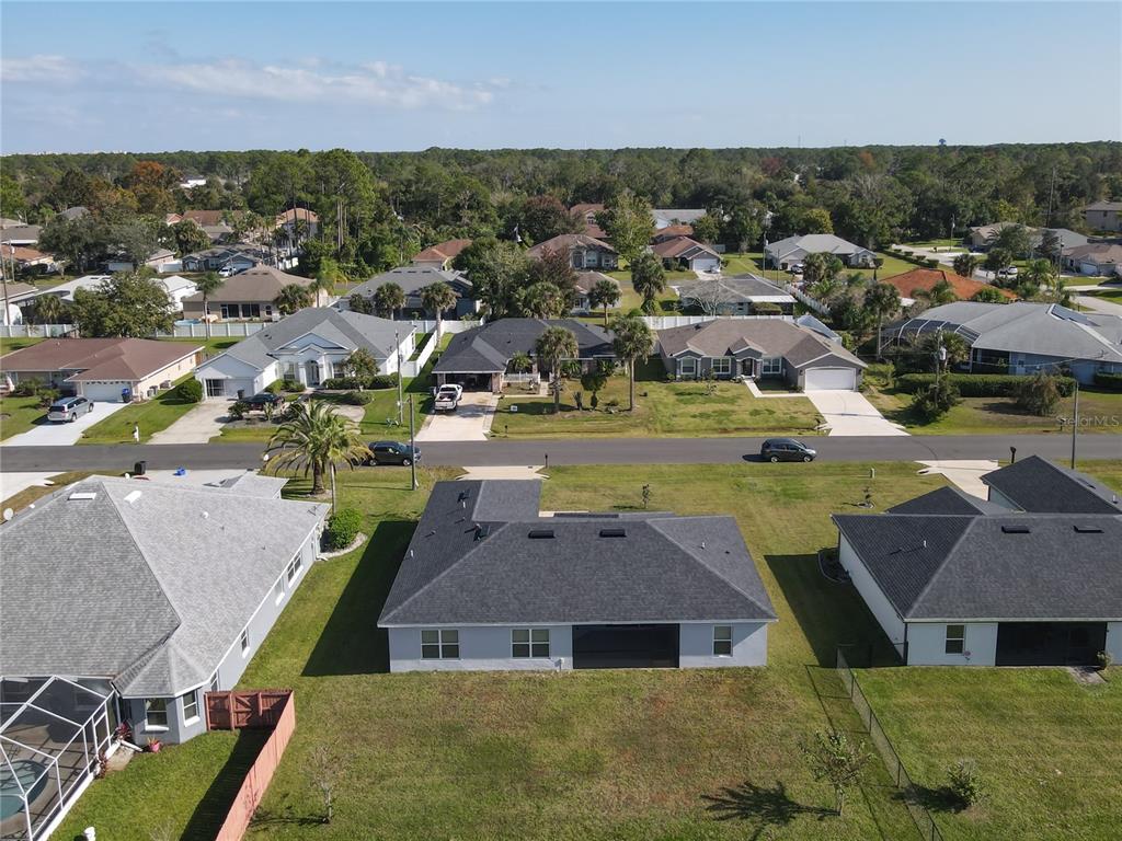 60 Ballenger Lane Palm Coast, FL 32137 - Photo 59 of 60 an aerial view of residential houses with outdoor space