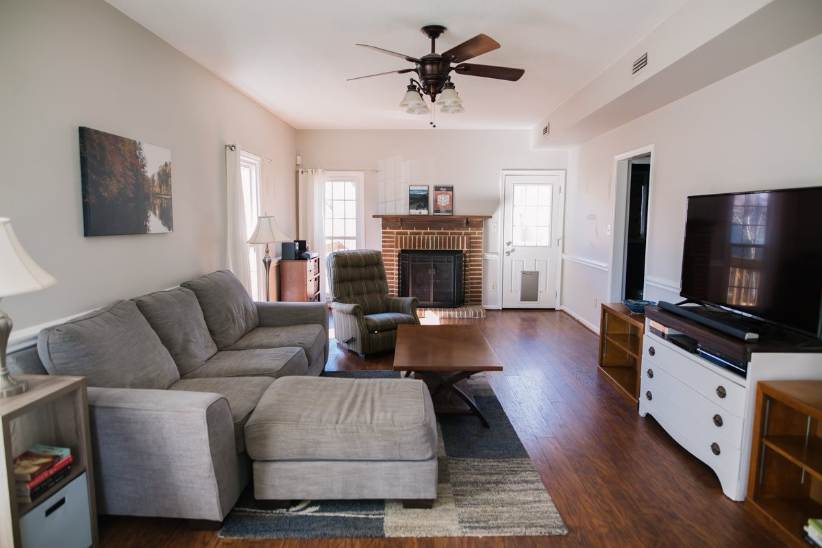 11808 North Exeter Way Raleigh, NC 27613 - Photo 4 of 30 Laminate Floor, Ceiling Fan w/Light, Windows, Natural Light, Gas Fireplace. Family Room