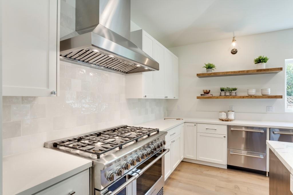 1057 Covington Road Los Altos, CA 94024 - Photo 12 of 31 a kitchen with white cabinets and appliances