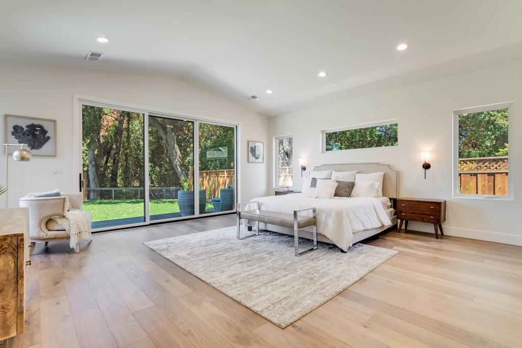 1057 Covington Road Los Altos, CA 94024 - Photo 13 of 31 a spacious bedroom with a bed a table and a large window